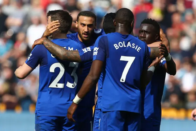 Everton players celebrate the opener against Swansea