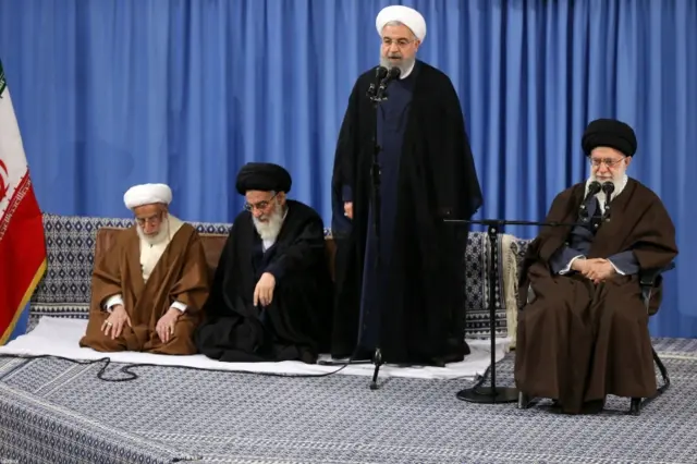 Rouhani (standing), supreme leader Ali Khamenei (R)