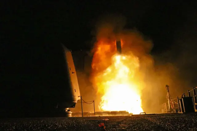 A guided-missile cruiser USS Monterey firing a Tomahawk missile, 14 April 2018