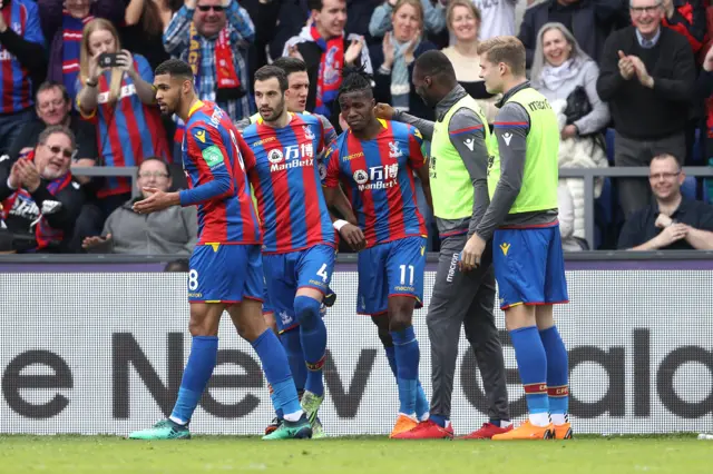 Zaha celebrating third goal