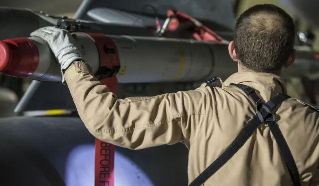 UK Ministry of Defence handout photo of a RAF Tornado pilot checking his weapons before taking-off on a sortie at RAF Akrotiri to conduct strikes (14 April 2018)