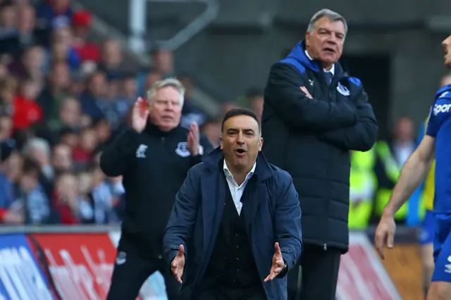 The managers react during Swansea v Everton