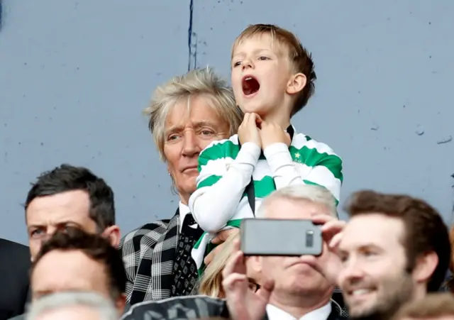 Rod Stewart watches the action from the Hampden Park stands