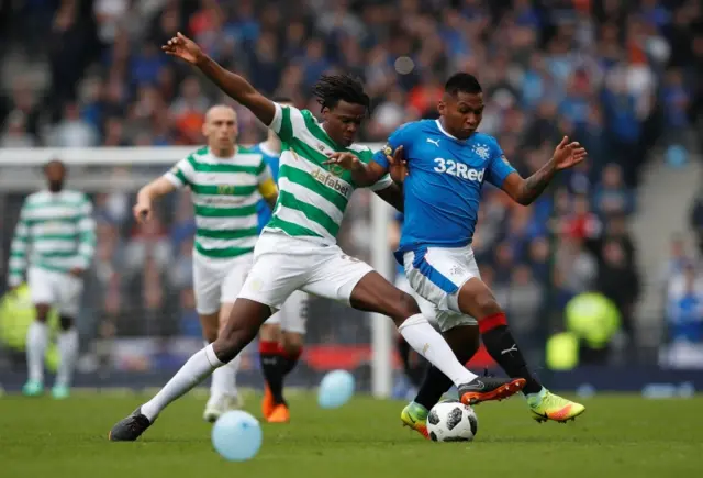 Celtic defender Dedryck Boyata challenges Rangers striker Alfredo Morelos for the ball