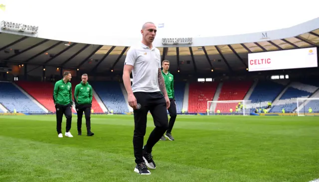 Celtic captain Scott Brown and some of his team-mates enjoy a stroll on the Hampden pitch