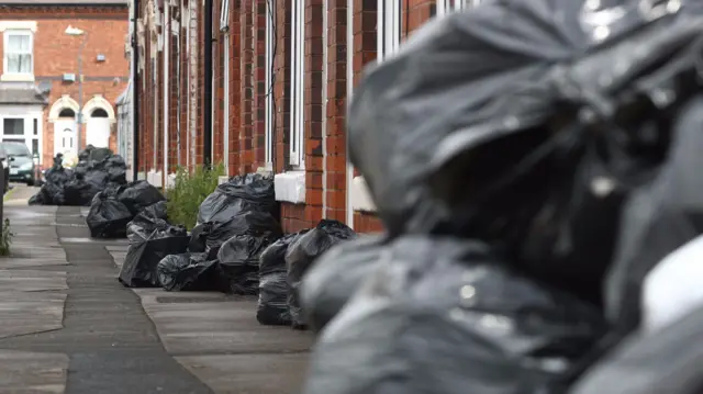 Bin bags in a street