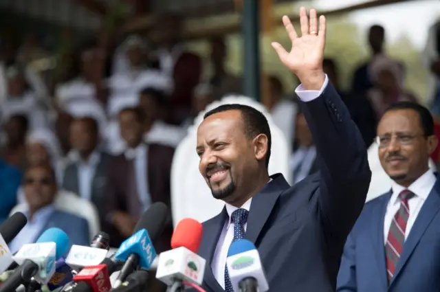 Abiy Ahmed waves to supporters as he delivers a speech during his rally in Ambo, about 120km west of Addis Ababa, Ethiopia, on April 11, 2018.