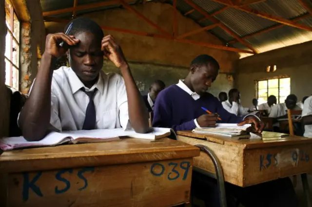 Secondary school students work at their desks