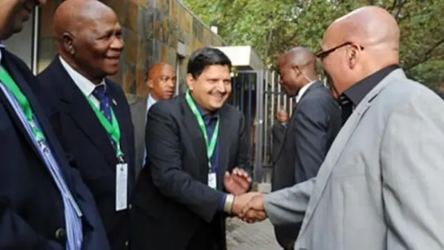 Atul Gupta (centre) shakes hands with President Jacob Zuma (right) in 2012. Their relationship has come under scrutiny in recent years