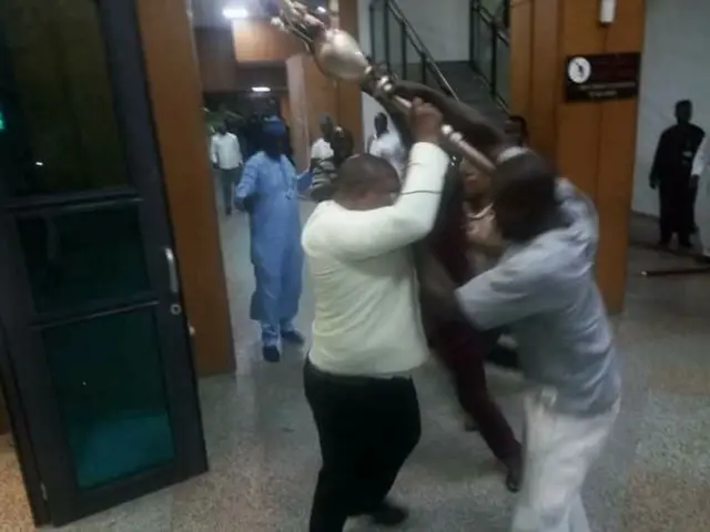 Men fighting for the mace