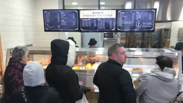 Shoppers at Chelmund's Fish and Chips.