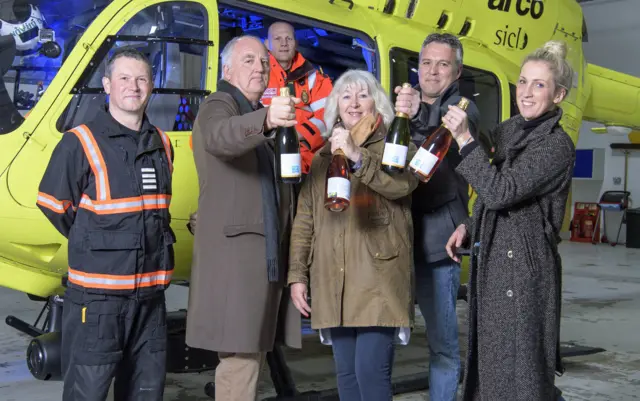 Yorkshire Air Ambulance Pilot Cpt Harry O’Neill, Paramedic Anthony Platt with Henry Wilson, his wife Heather, and children Tom Wilson and Alice Maltby from Little Wold Vineyard