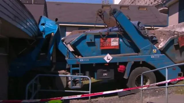 truck that has crashed into a building