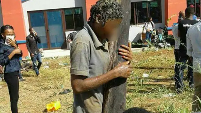 A student at Unizambeze covered in human waste