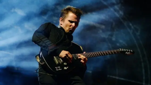 Matt Bellamy performing with guitar