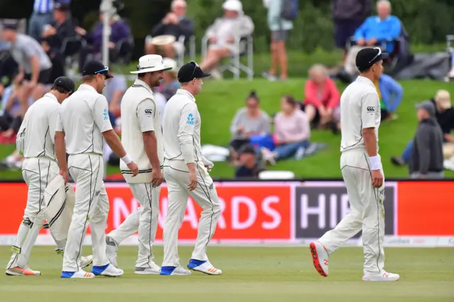 New Zealand's fielders walk off