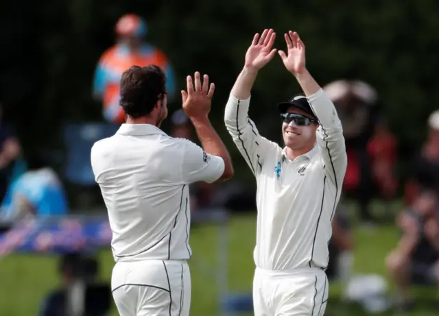 Henry Nicholls celebrates