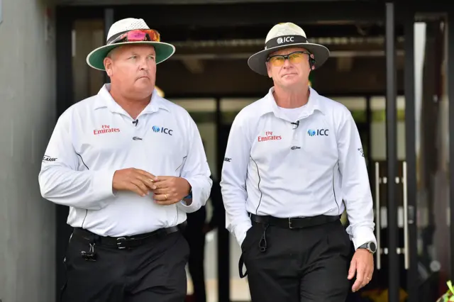 Umpires Marais Erasmus and Bruce Oxenford