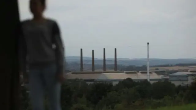 Blurred image of teenager against Rotherham landscape