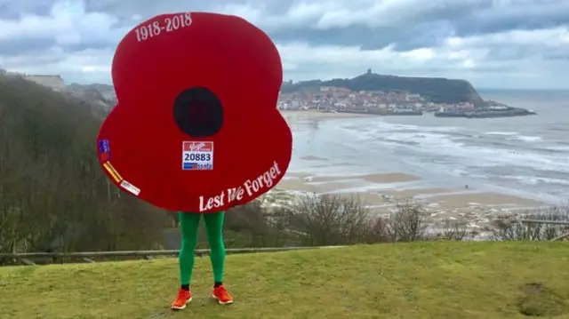 Owen Willis - running the marathon dressed as a poppy.