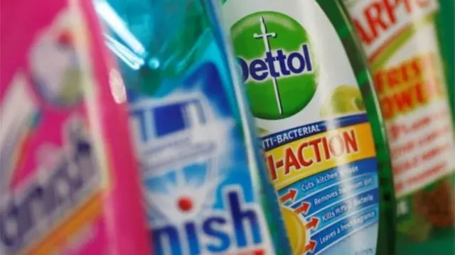 Bottles of cleaning products made by Reckitt Benckiser, on a shelf.