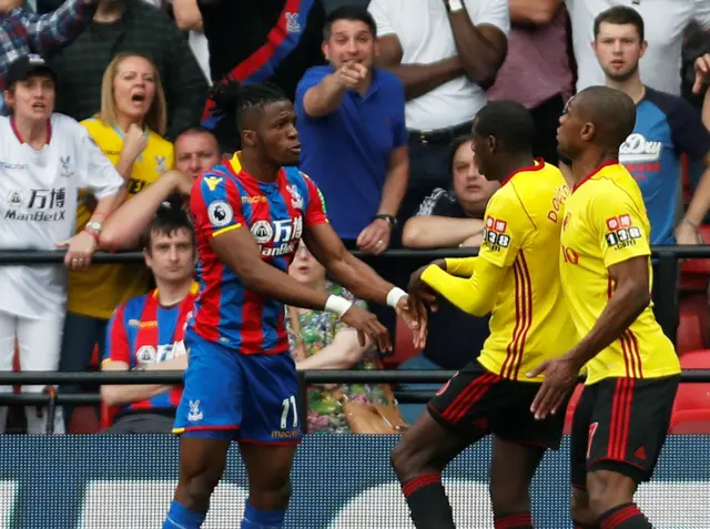 Wilfried Zaha clashes with Watford's Abdoulaye Doucoure