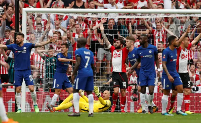 Caballero escapes after dropping the ball over his own line