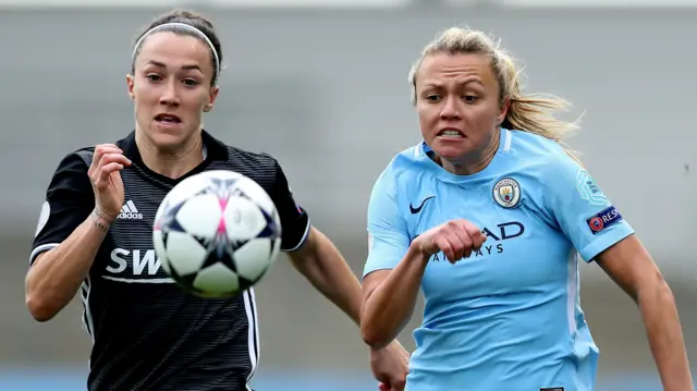 Lucy Bronze (left) chases the ball