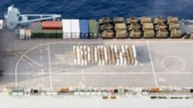 Aerial of HMS Albion crew spelling "boy"