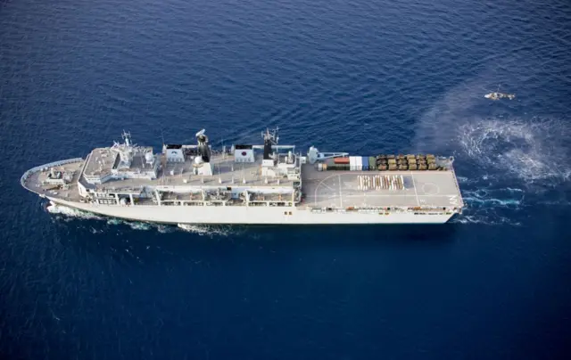 Aerial of HMS Albion crew spelling 'boy'