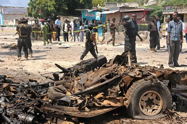 Somali security investigate the scene of a suicide attack in Mogadishu on July 31, 2016.