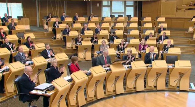 Applause from the SNP benches as the minister finishes his speech