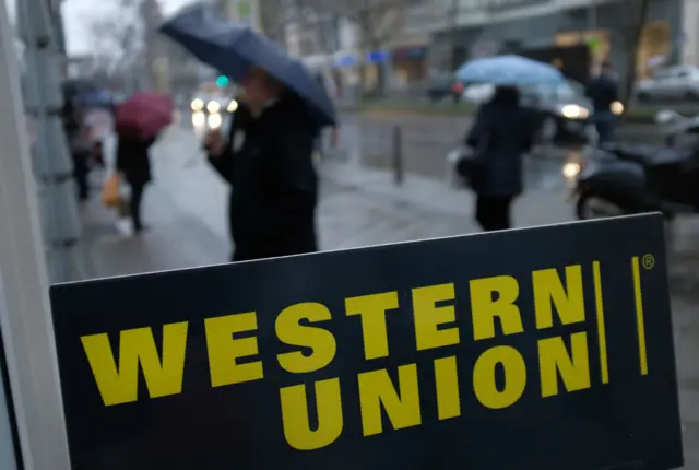 A sign advertises the money transfer service Western Union on January 11, 2018 in Berlin, Germany.