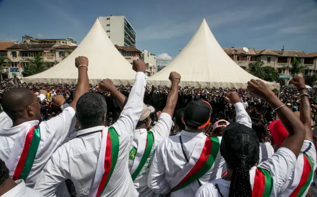 Opposition supporters and deputies shout slogans as they gather at 'May 13 Square' in Antananarivo on April 23, 2018