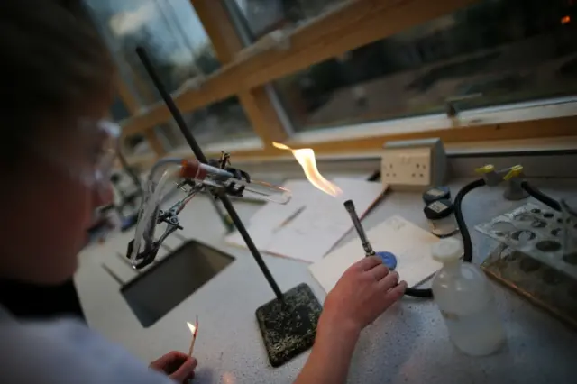 Student takes part in a science lesson