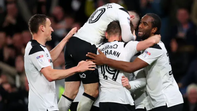 Derby players celebrate