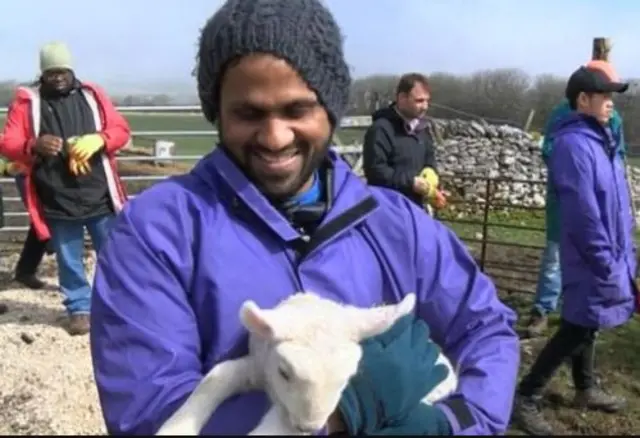 Asylum seeker with lamb