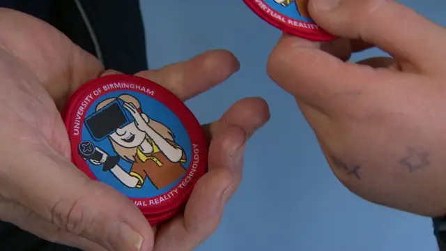 close up of brownie badges being handed out