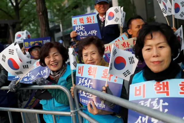 Koreans waving flags