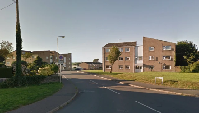 Entrance to Urban Road with three storey flats