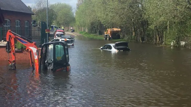 Vehicles under flood water