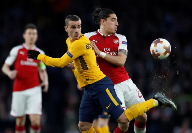 Atletico Madrid"s Antoine Griezmann in action with Arsenal"s Hector Bellerin