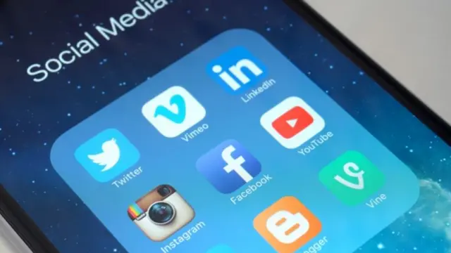 iPhone 6 Plus screen displaying icons of social media applications