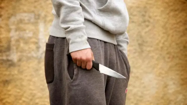 A youth with a knife