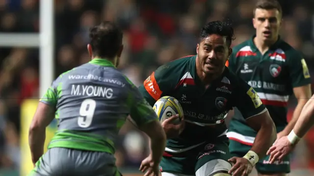 Manu Tuilagi runs at the Newcastle defence