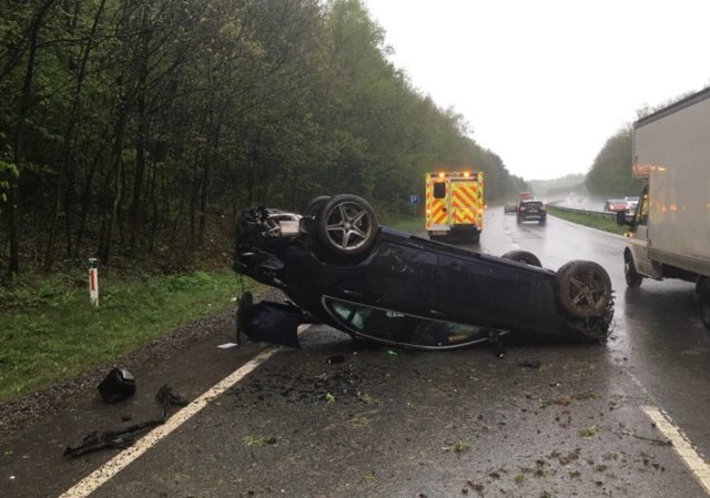 Overturned car on A38