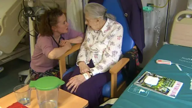 Patient Monica Graham with a hospital worker