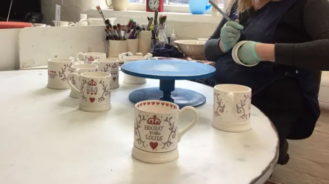 Mugs being painted at Emma Bridgewater