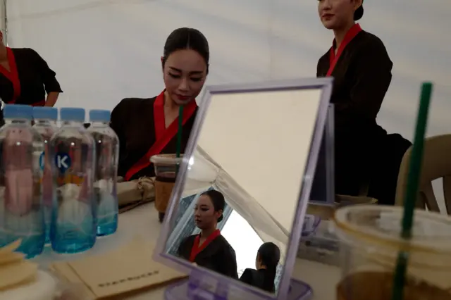 Performers prepare backstage to take part in a mass Buddhist prayer ceremony in support of the inter-Korean summit meeting between South Korean President Moon Jae-in and North Korean leader Kim Jong Un, in central Seoul on April 27, 2018.