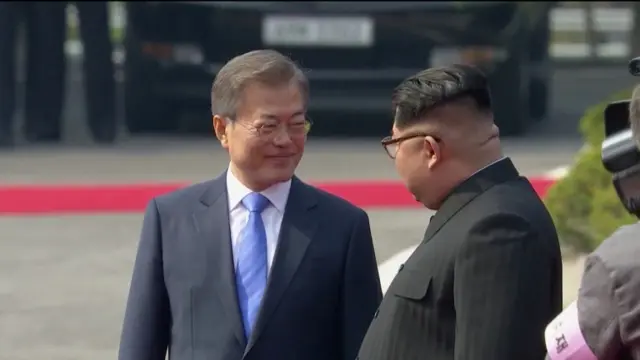 Moon smiles at Kim